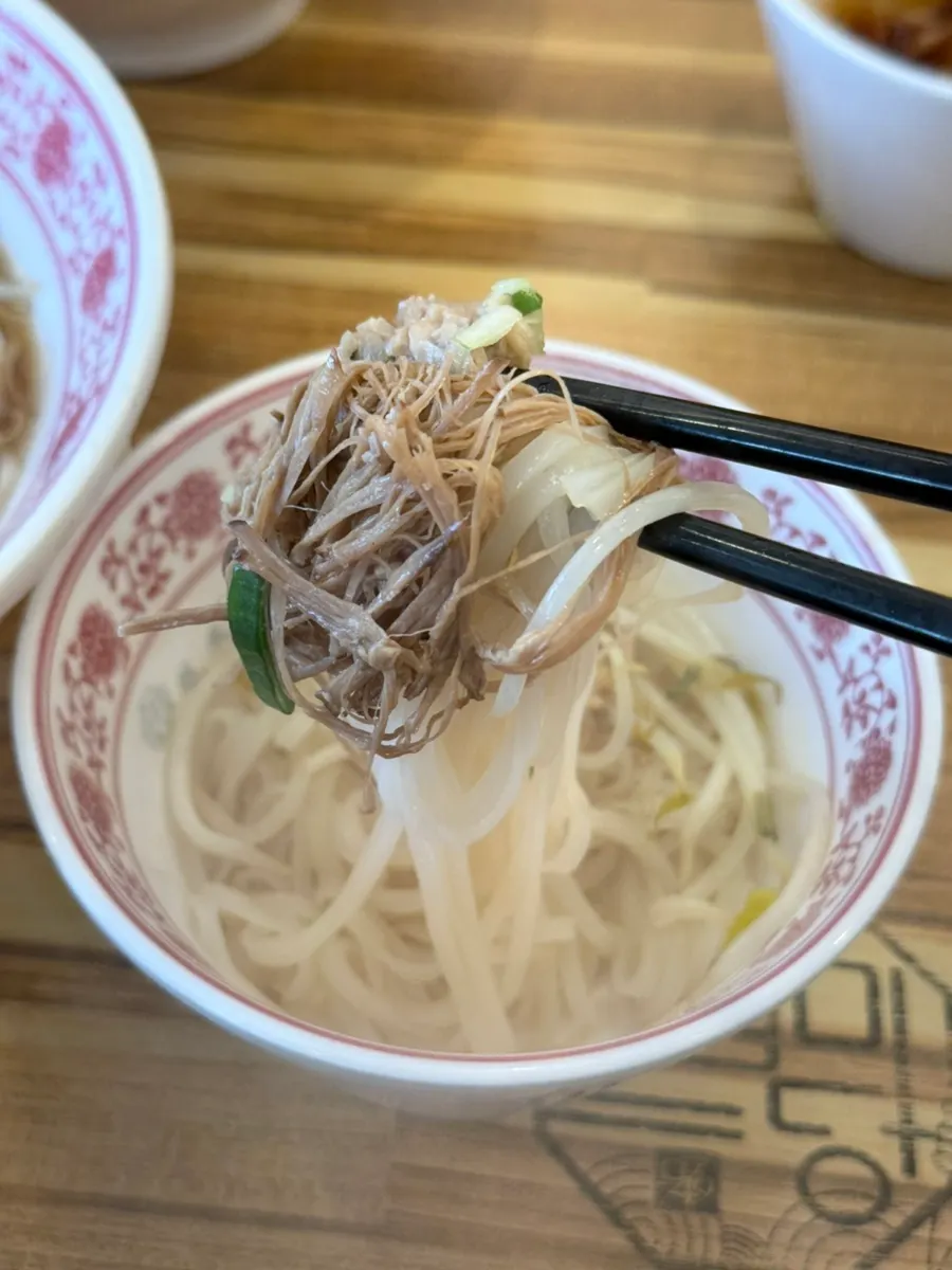 Broth and toppings in the beef brisket pho