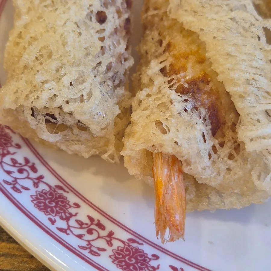 Close-up of shrimp cha gio showing the shrimp tail