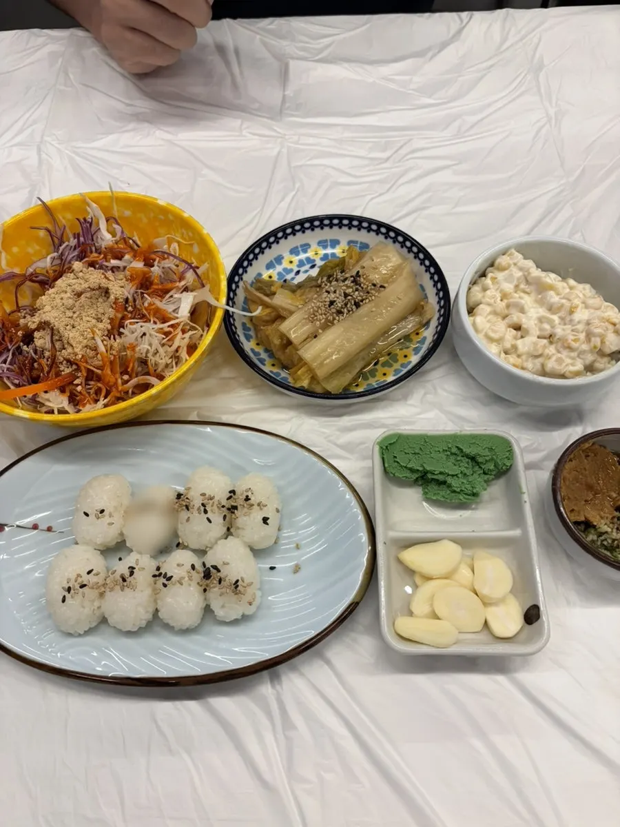 A generous spread of banchan set on the table