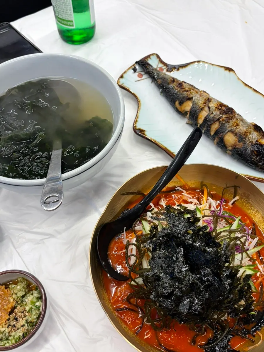 Side dishes including mulhoe, seaweed soup, and grilled fish