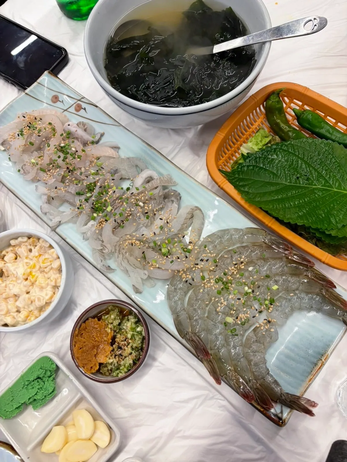 Table spread of the raw shrimp and sashimi set for two