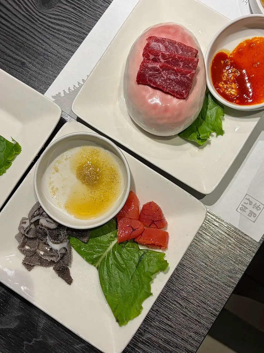 Plate of myeongi namul, baek-kimchi, and japchae