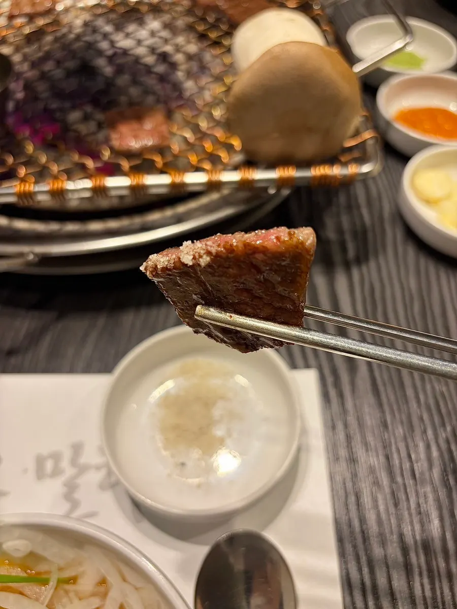 Hanwoo salchisal placed on the charcoal grill