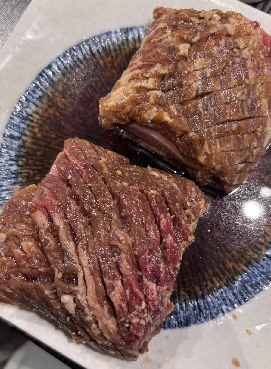 Two servings of seasoned galbi set out in the room