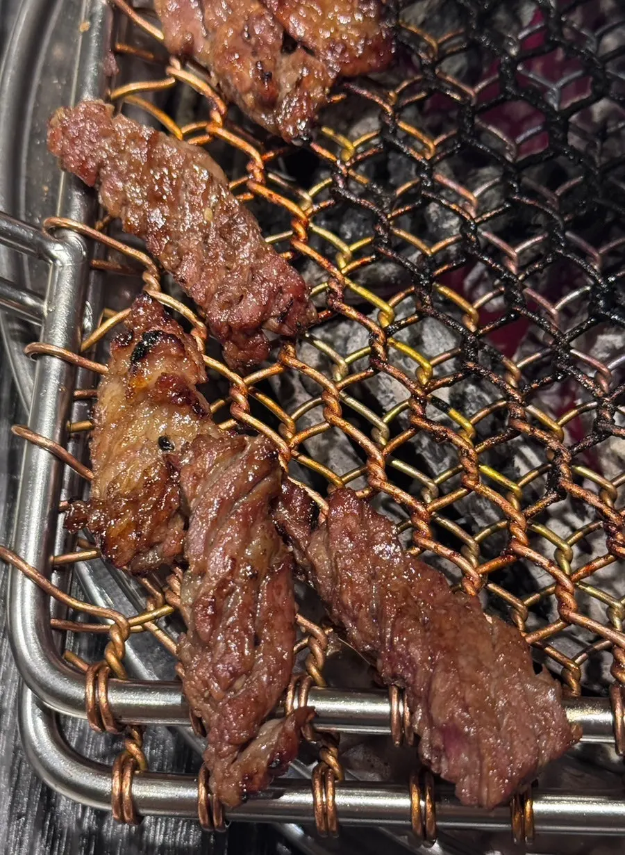 A fully grilled piece of seasoned galbi