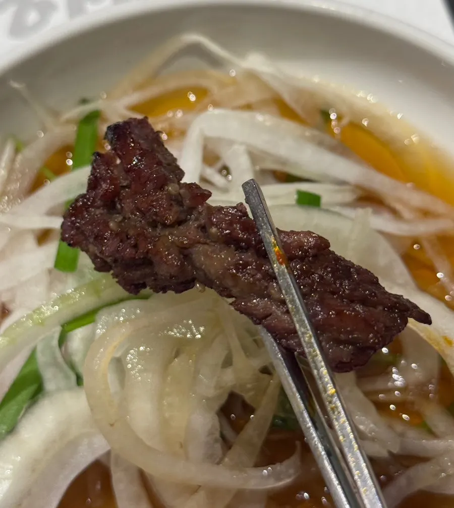 A full spread of seasoned galbi served with rice