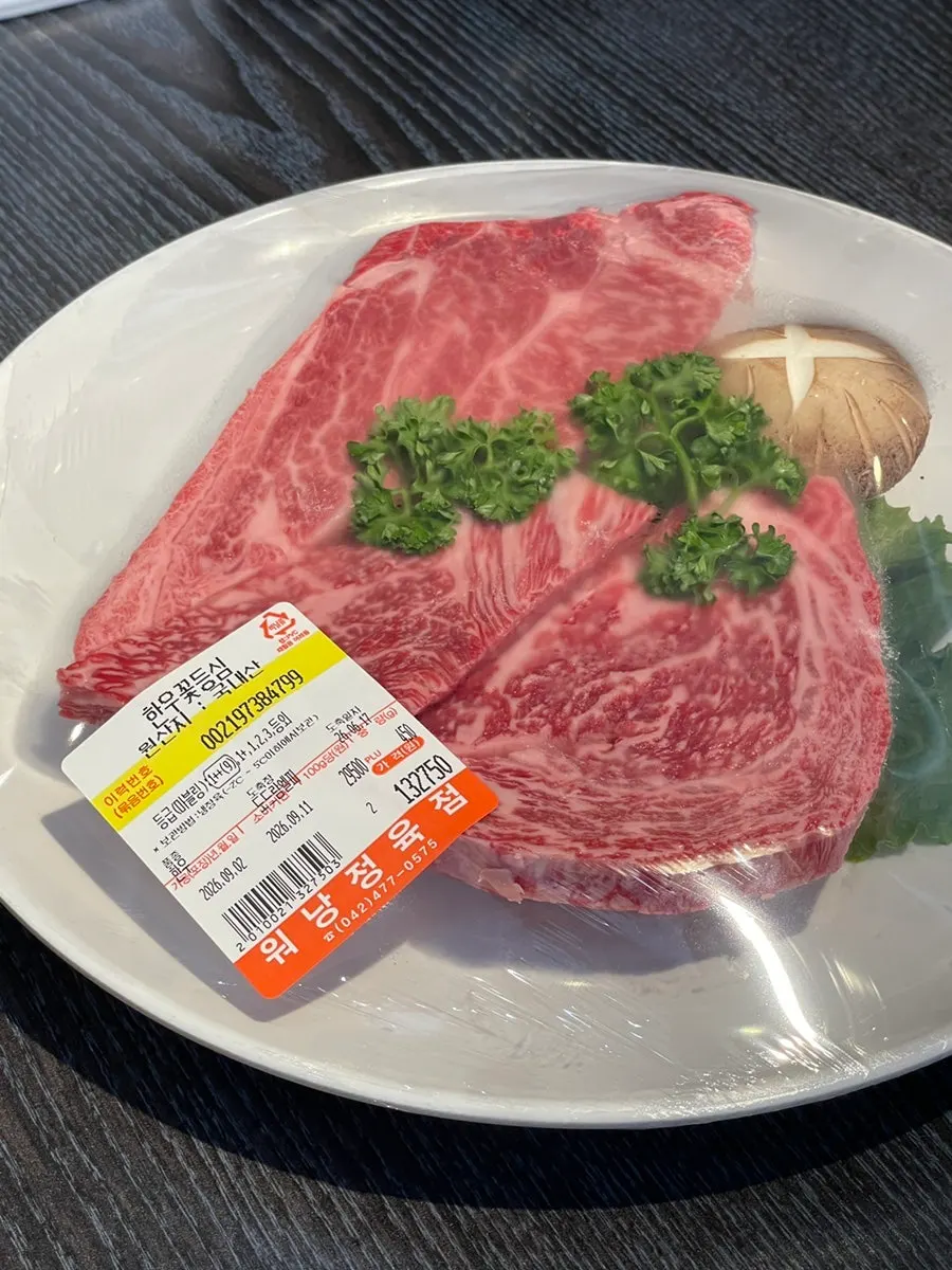 Plate of densely marbled hanwoo flower ribeye