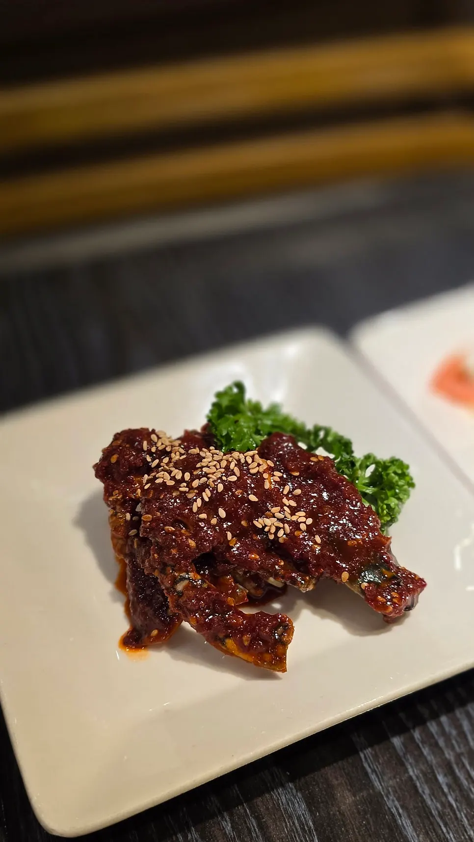 Wonang seasoned galbi placed on the charcoal grill