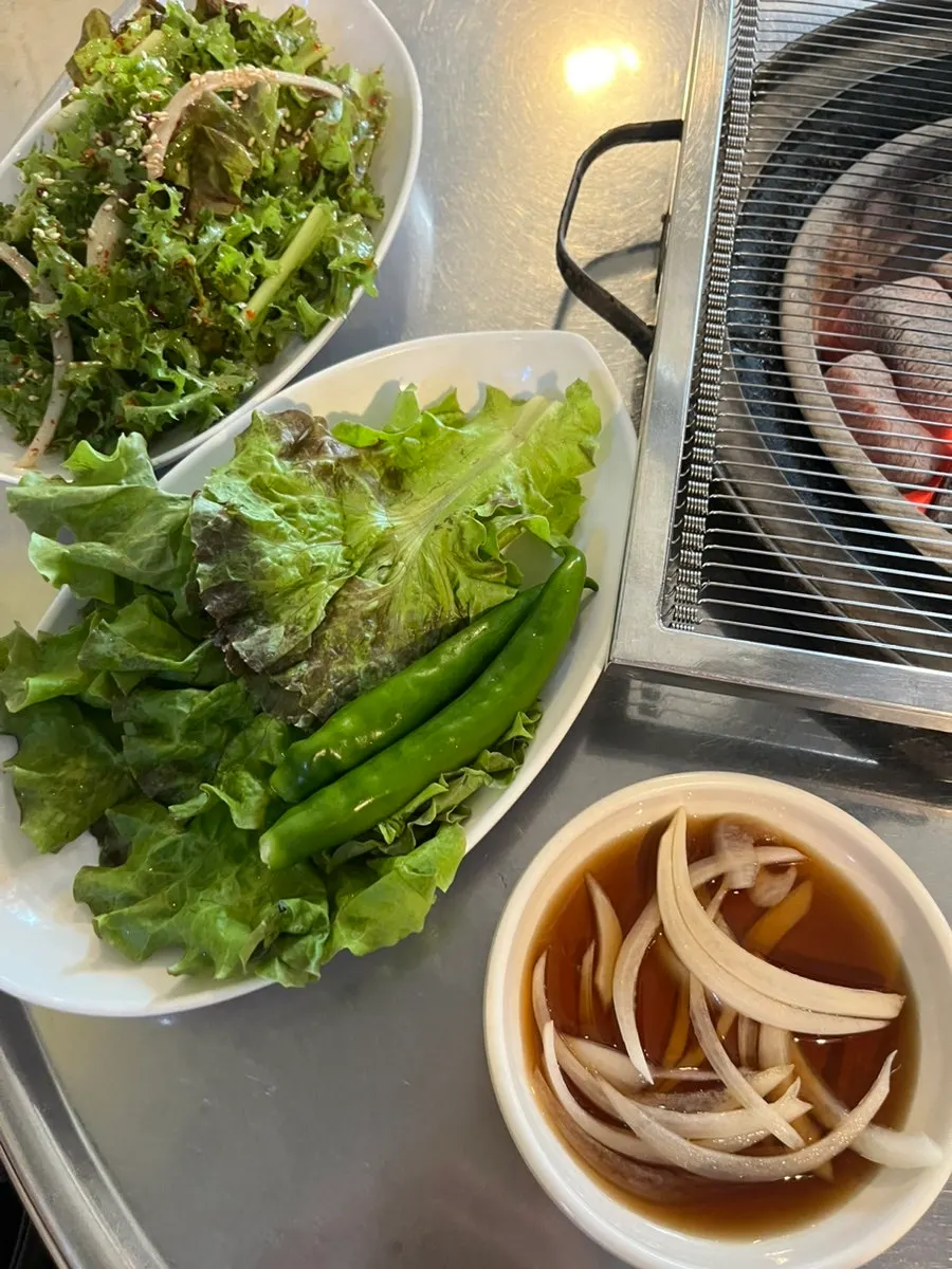 Lettuce wraps and water kimchi among the side dishes