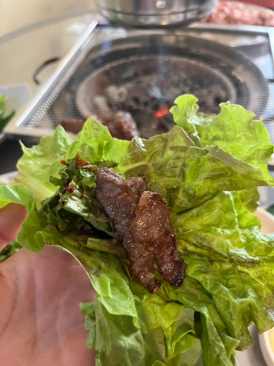 Refreshing chicory salad next to grilled meat