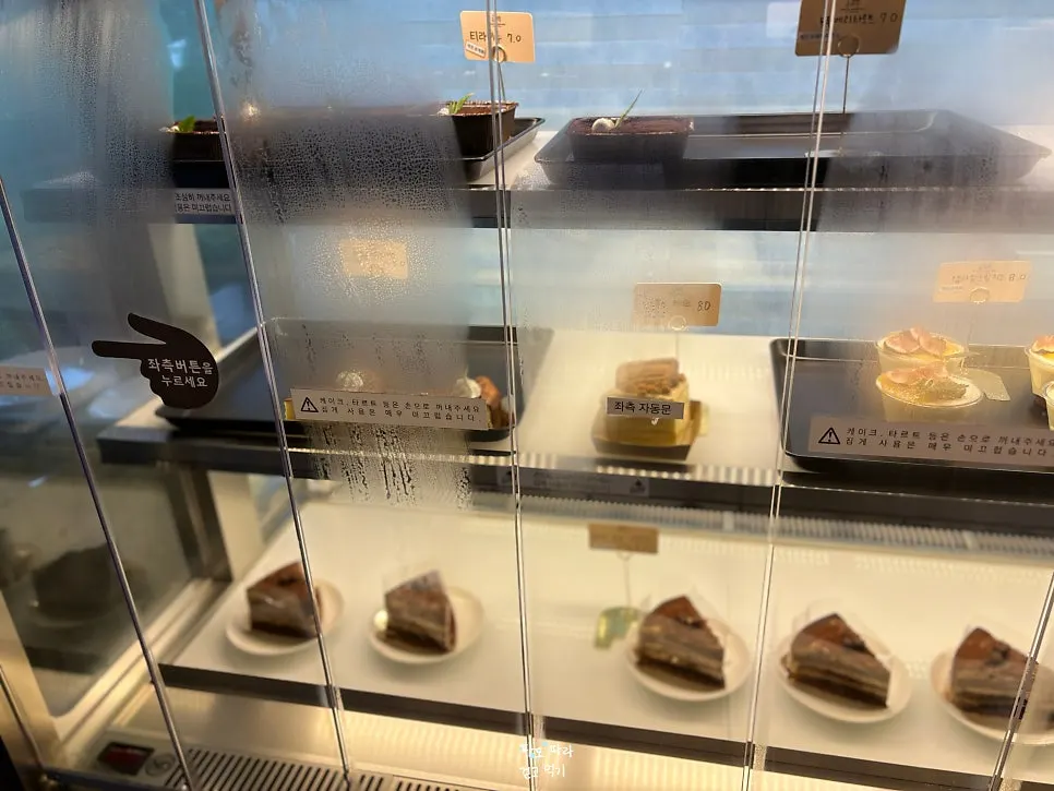 Bakery display case with dozens of bread varieties