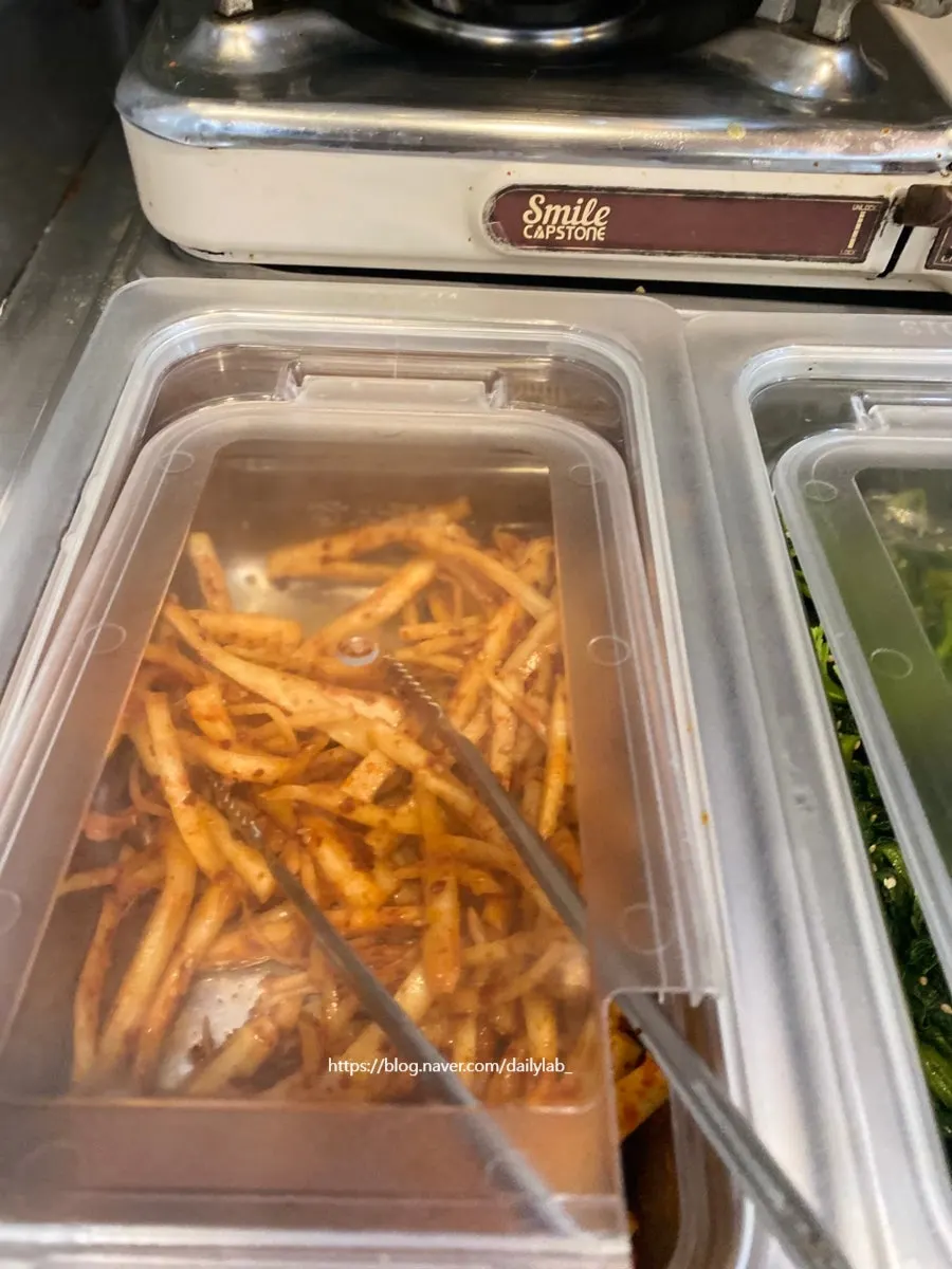 Self-serve corner for extra rice and side dishes