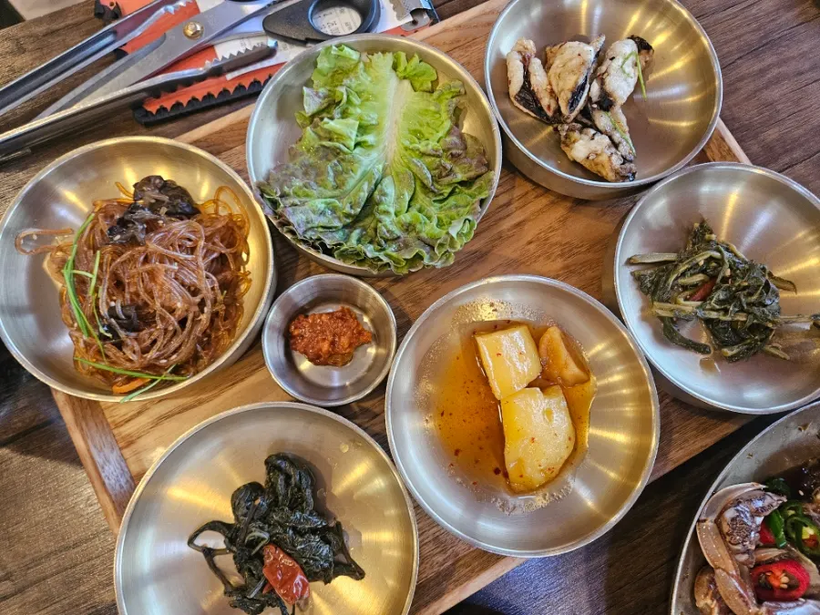 Korean side dishes laid out for the Tteuranchae Bapsang set for two