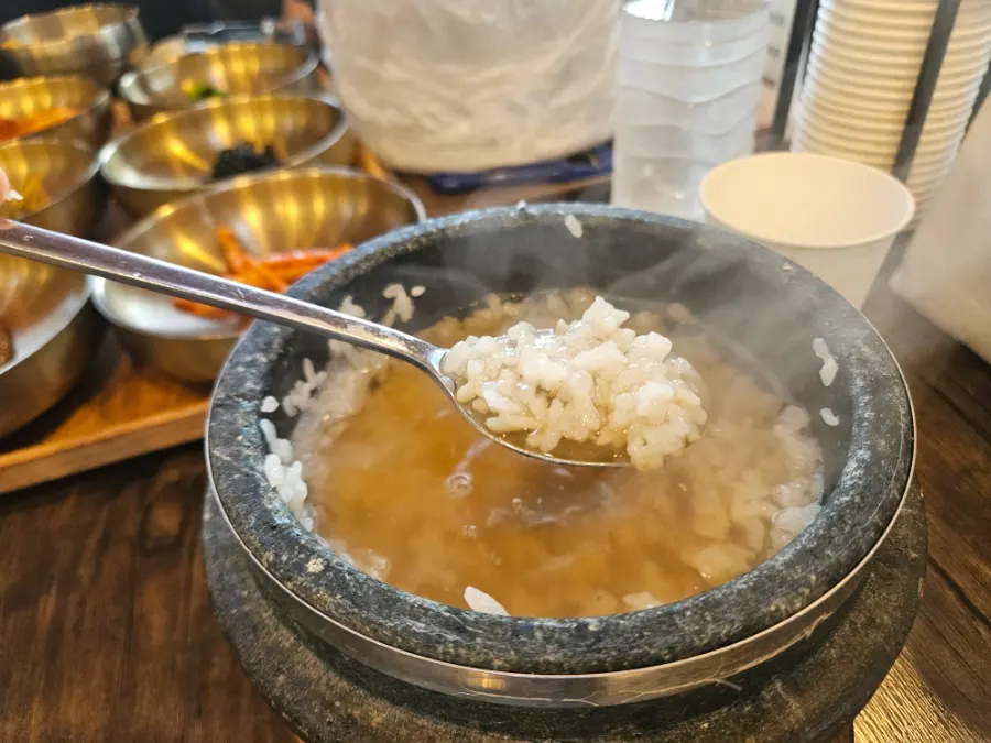 A spoonful of white rice with ganjang gejang