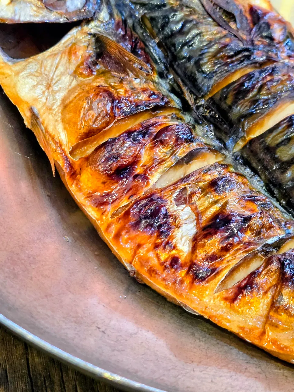 Grilled mackerel with a glossy, golden-brown sear