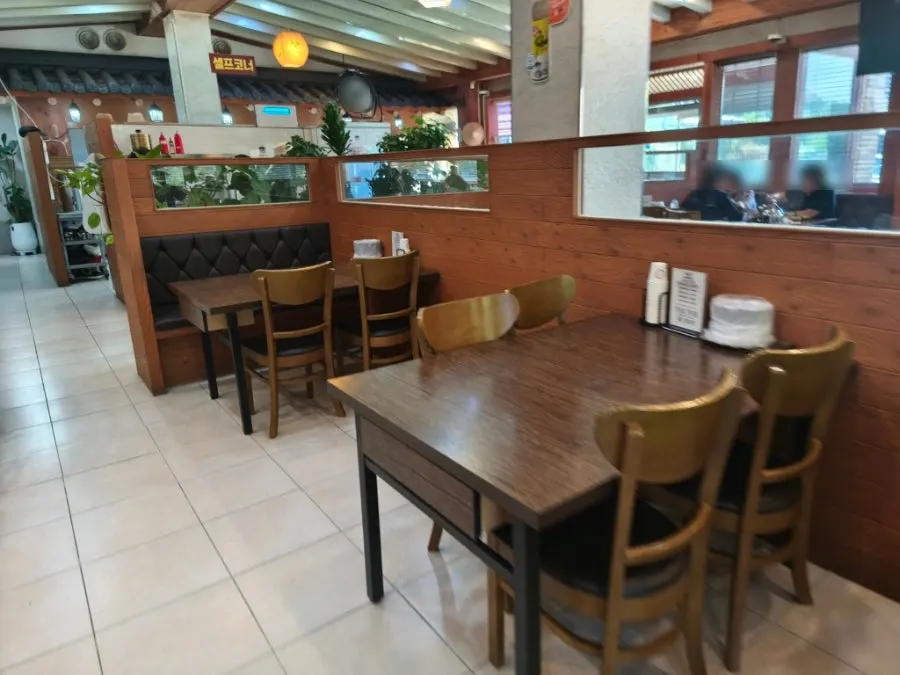 Spacious dining hall and tables inside the hanjeongsik restaurant