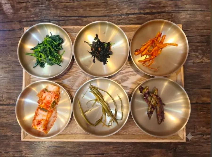Full view of side dishes arranged like a 12-dish spread