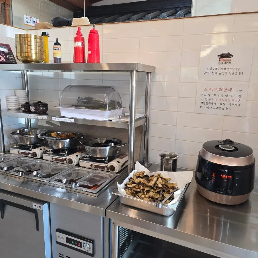 Containers of side dishes prepared at the self-service corner
