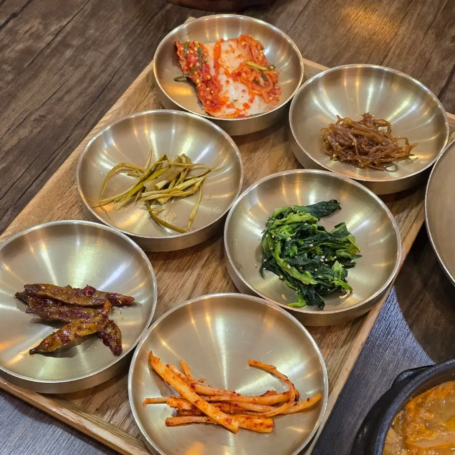 Dining table set with a variety of side dishes