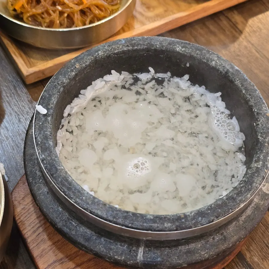 Freshly cooked stone-pot rice served with the Tteuranchae Bapsang