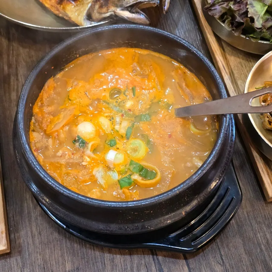A full Korean meal with cheonggukjang and stone-pot rice together