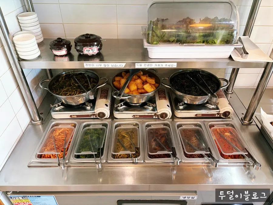 Self-serve corner where side dishes can be freely refilled