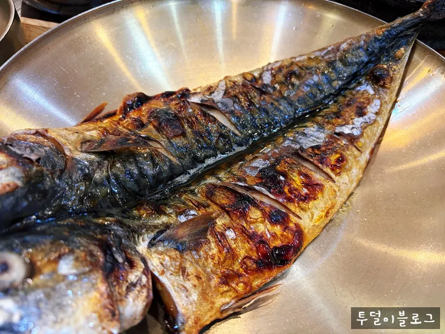 Close-up of the golden, crisply grilled mackerel