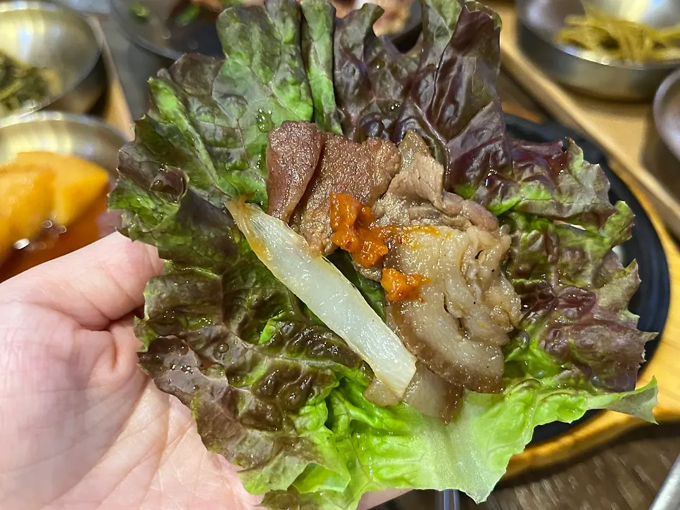 Charcoal-grilled pork laid over a bed of onions