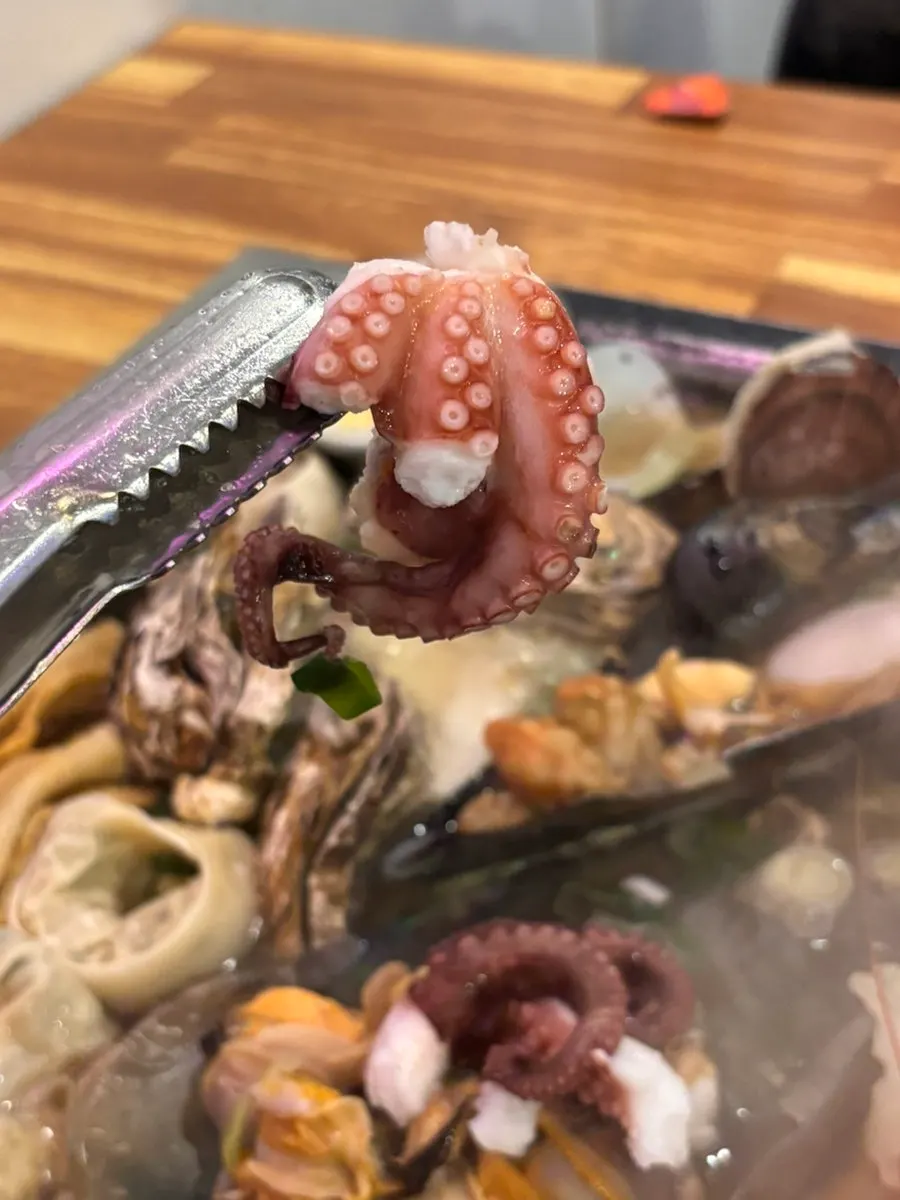 Abalone and clams cooking through