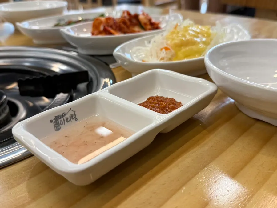 Side dishes for bossam including salad, chive salad and fish cake