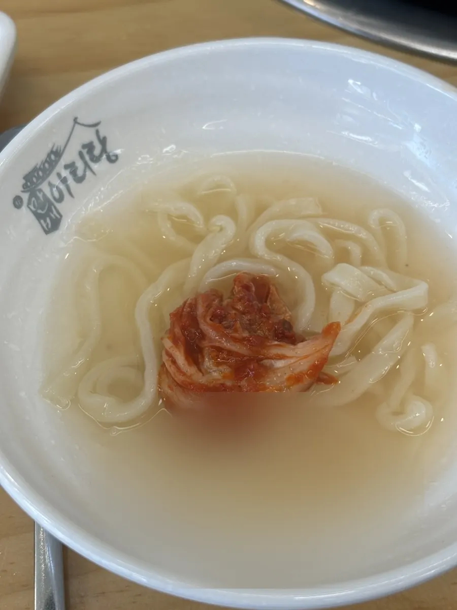 Kalguksu noodles lifted up with chopsticks