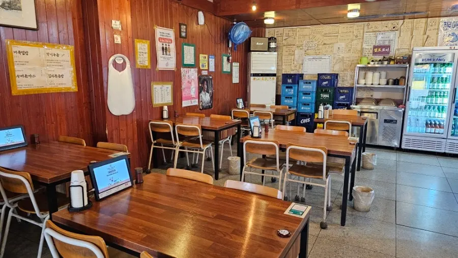 Wood-toned interior with old school chairs inside the restaurant