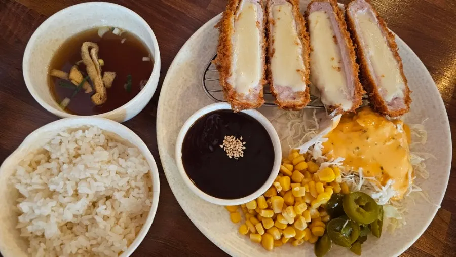 Fish cake udon served with side dishes on the table