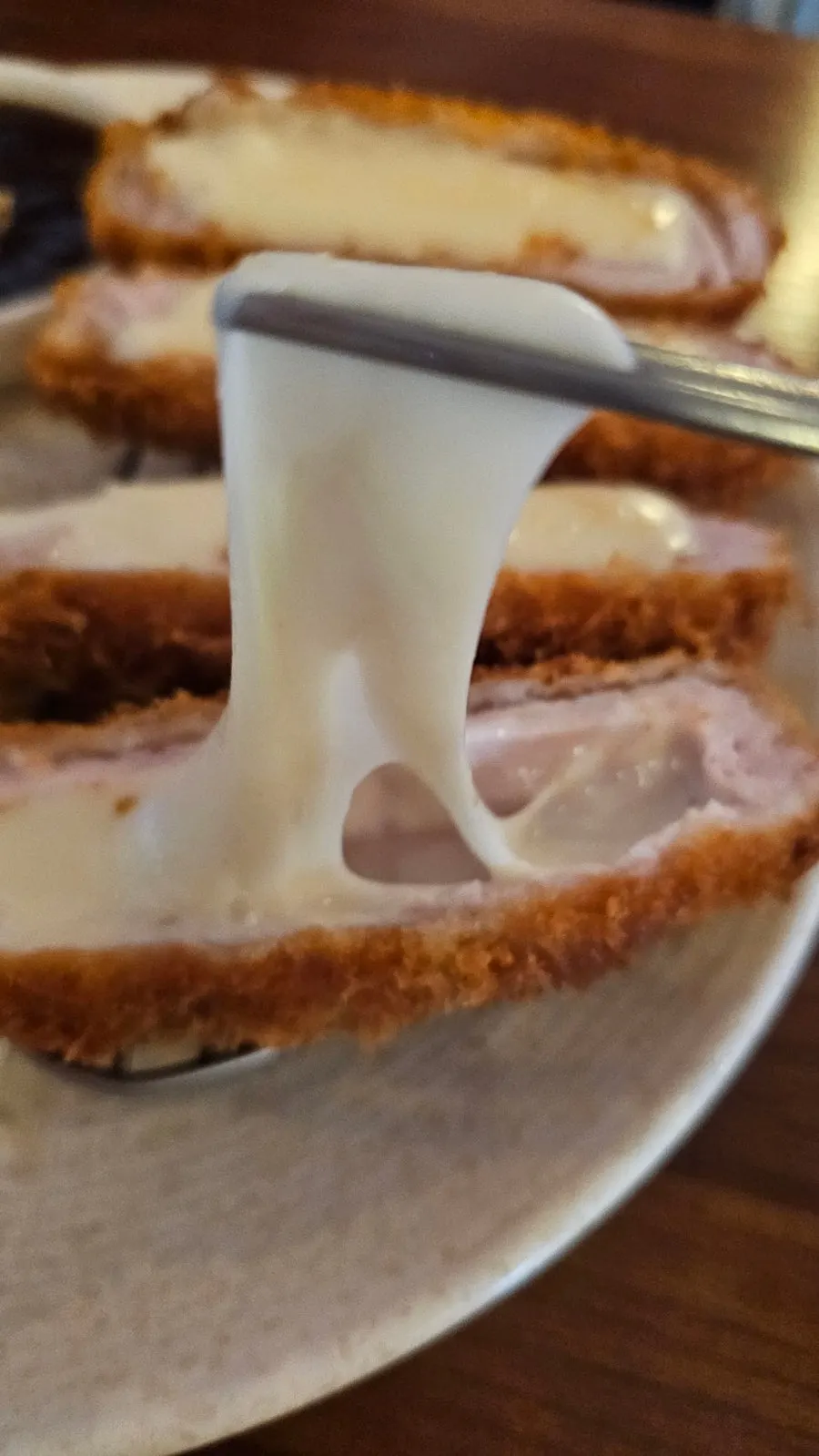 Cheese tonkatsu with mozzarella cheese overflowing