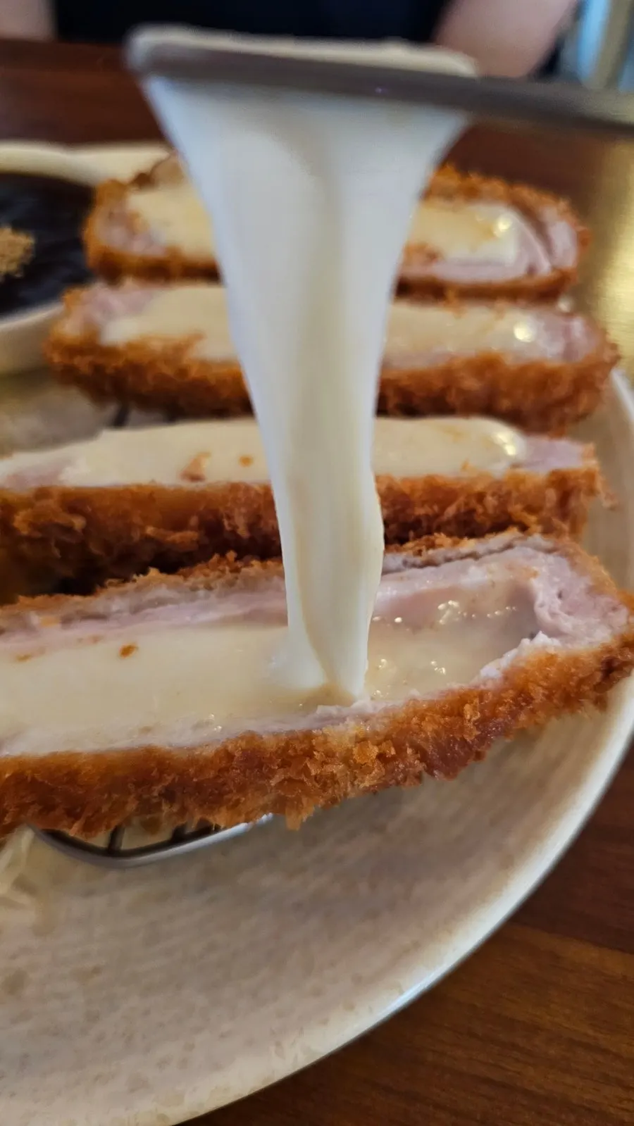 Cross-section of a thick-cut cheese tonkatsu