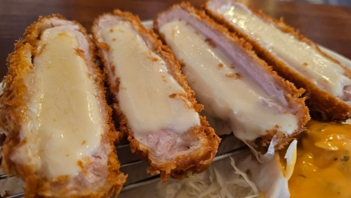 A plate of crispy-breaded cheese tonkatsu