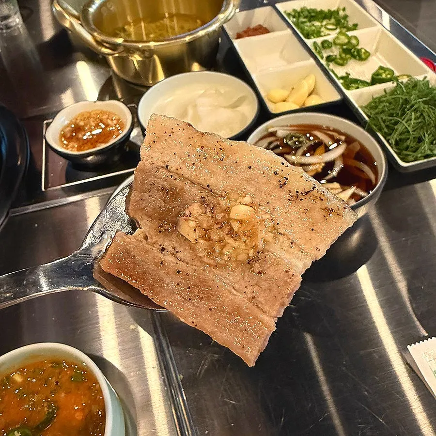 Garlic-saeujeot sauce served with cold pork belly