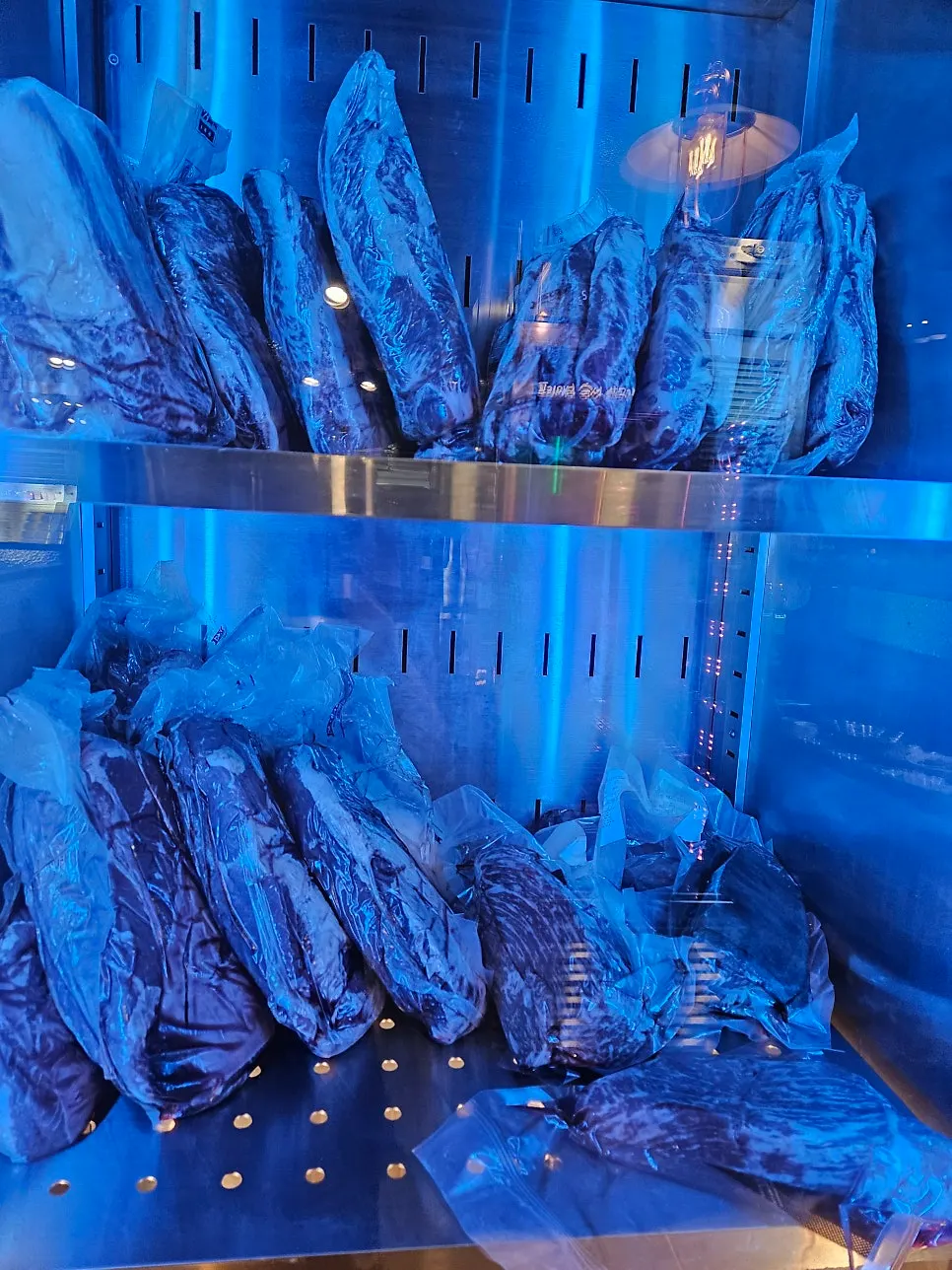 Pork displayed inside the aging fridge