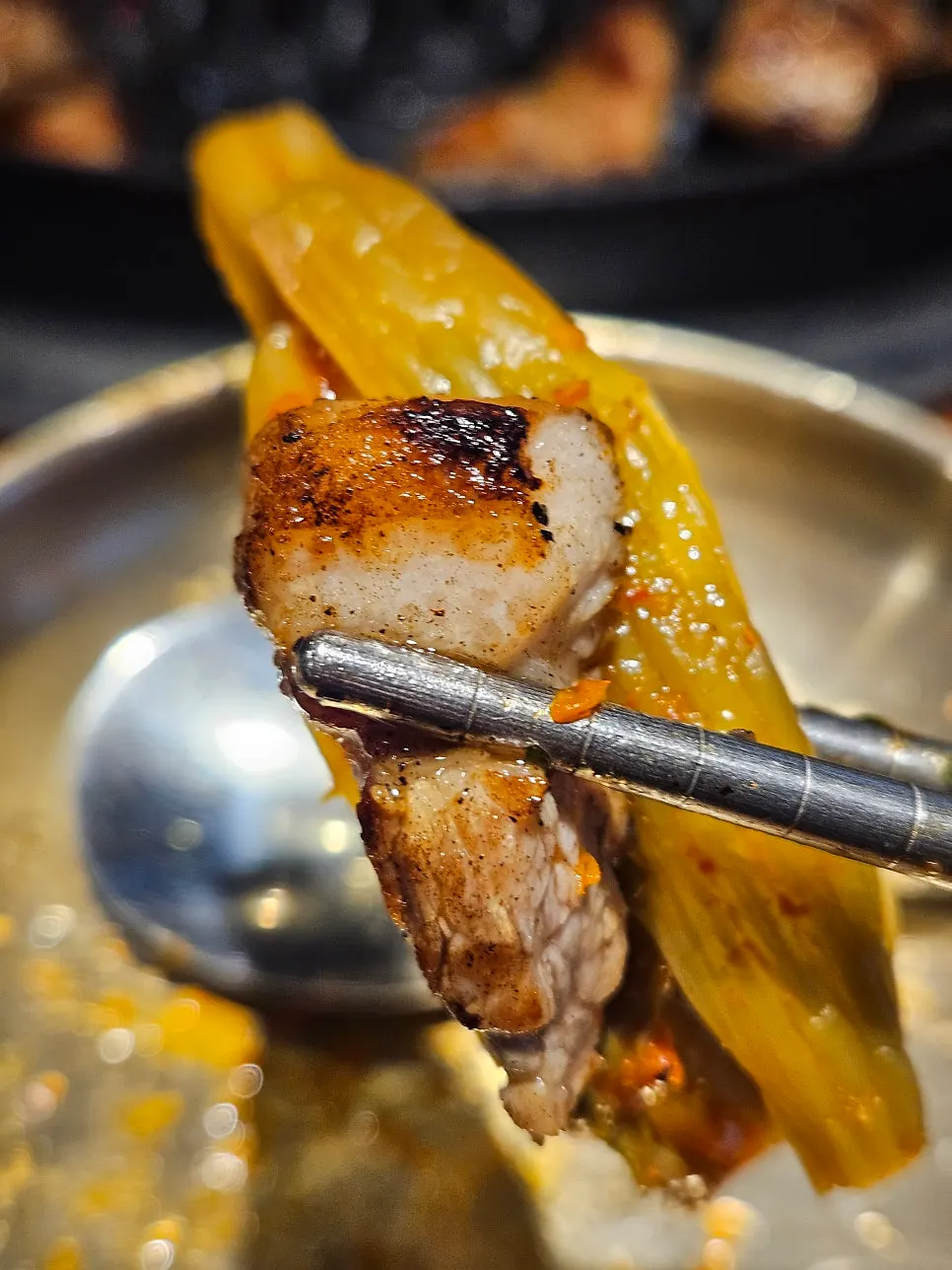 Thick-cut aged neck meat grilling on the barbecue