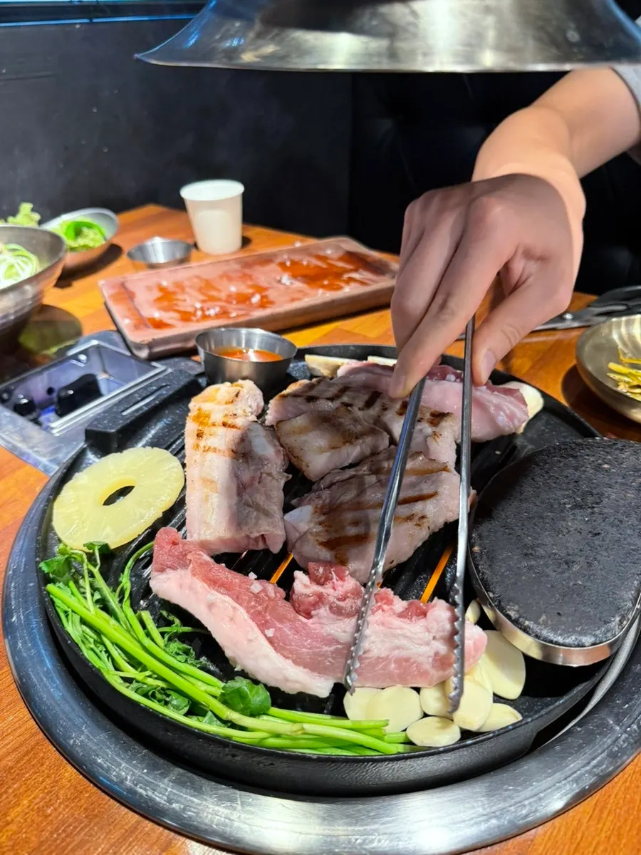 A grilled piece of samgyeopsal