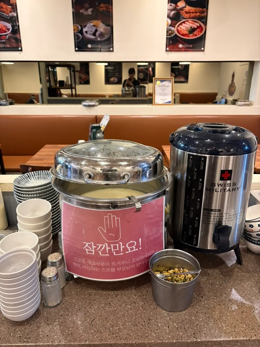 Self-serve bar corner with aprons and small plates