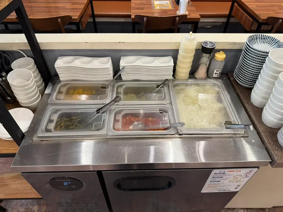 Self-serve bar with banchan and soup at Wonkwang Katsu