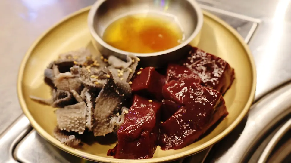 Bowl of onion garnish and sauce