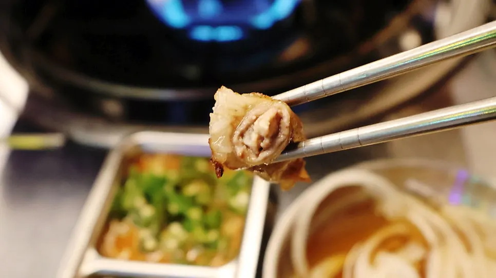 Heart, rice cake, and garlic on the hot plate