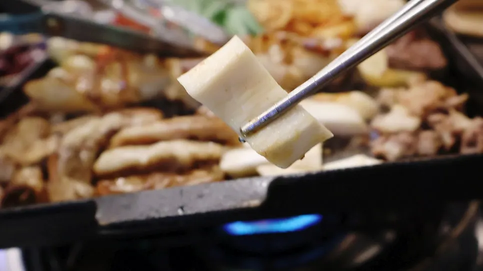 Table view of the mixed platter being grilled