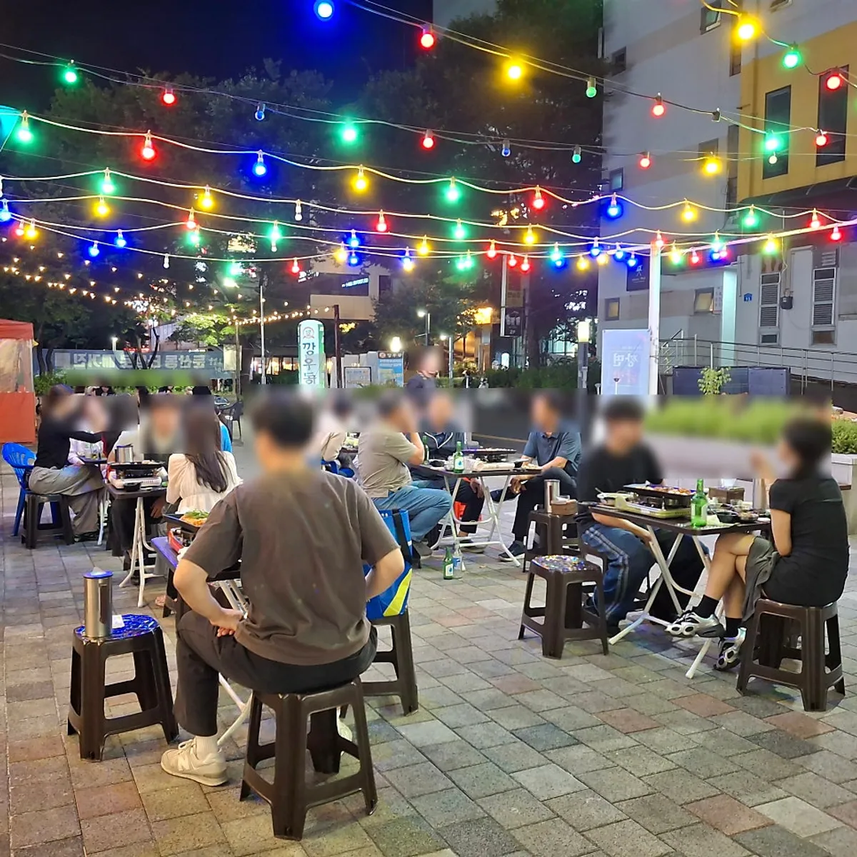 Lit-up patio seating at Uhwa Gopchang