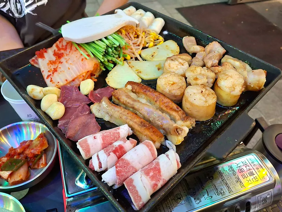 Pre-grilled gopchang platter on the grill