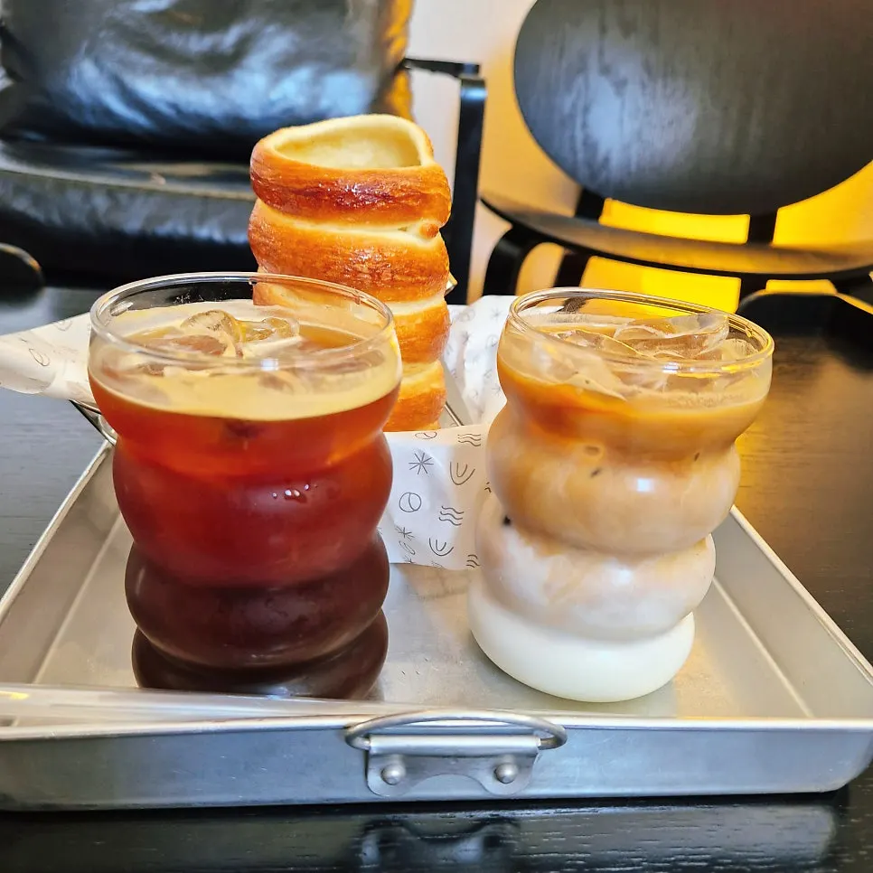 Iced americano enjoyed with chimney bread
