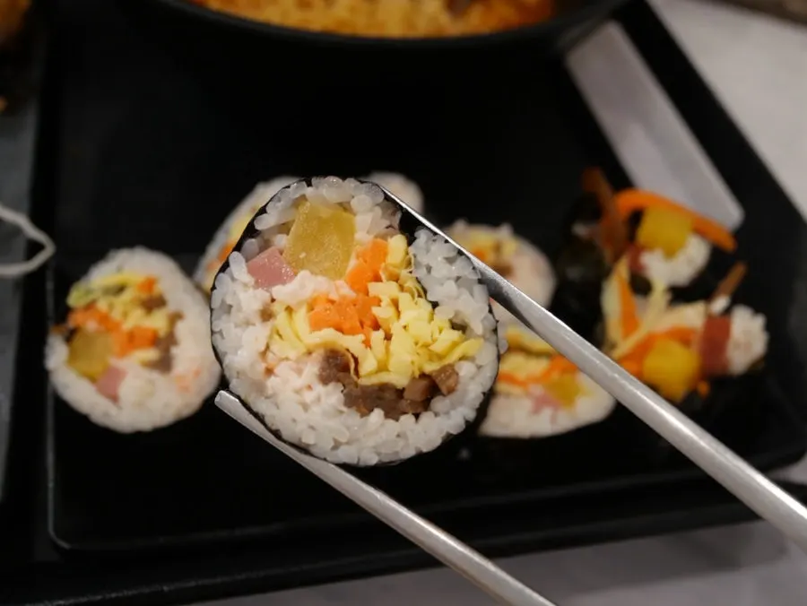 Ramen noodles lifted with chopsticks