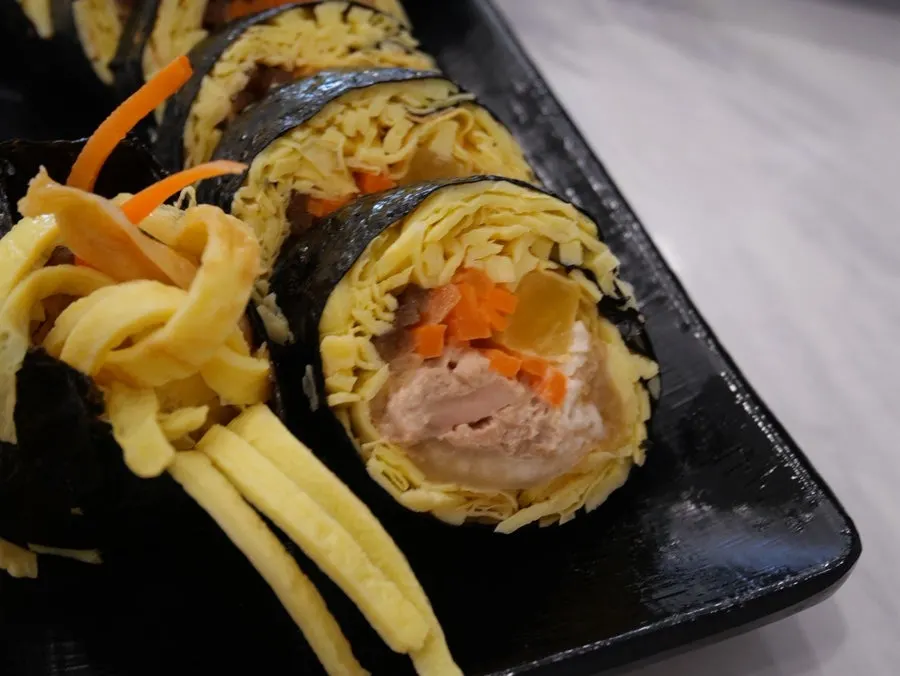 A piece of hand-made pork cutlet with a side of salad